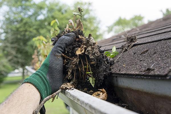 gutter cleaning should be done at least twice a year to remove debris and prevent clogs